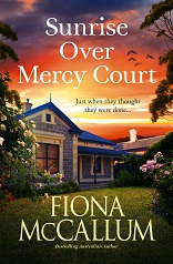 The cover of a book by Fiona McCallum titled Sunrise Over Mercy Court, featuring a house with orange sky behind and garden in front.